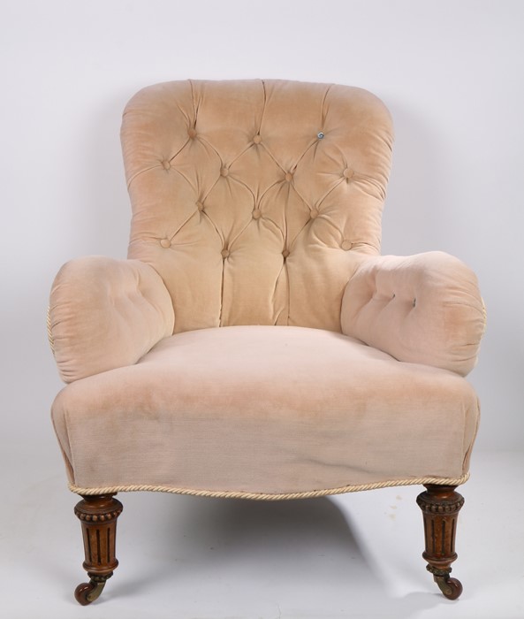 Gillow: A Victorian Upholstered Armchair, circa 1870, the arched back above a stuff over seat