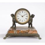French late 19th Century desk clock, the drum case held aloft by cherubs raised on a marble vase and