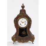 19th Century Boulle work mantel clock, surmounted by a flaming urn above ormolu mounts and swag