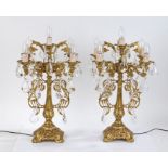 Pair of ormolu four branch candelabra lamps, each with central sconce and four scrolled pierced arms