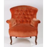 Victorian mahogany button back armchair, the wide curved wingback with splayed scrolling arms