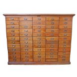 An impressive late Victorian/Edwardian mahogany and teak bank of drawers, of good proportions, the