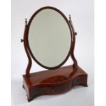 George III mahogany and chequer strung toilet mirror, the oval mirror plate held within a pair of