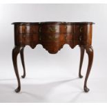 Queen Anne style walnut lowboy, early 20th Century, the serpentine top above six drawers and a