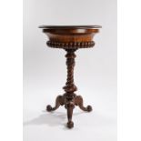 Victorian walnut sewing table, the circular top opening to reveal a fitted interior with upholstered