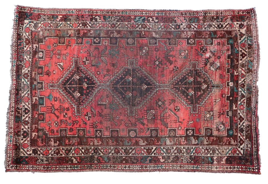 Old Persian Shiraz carpet, the red ground with triple lozenge pattern centre, 270cm x 164cm
