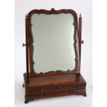 George III mahogany toilet mirror, the mirror plate within an undulating gesso frame held between