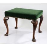 George II walnut pad foot stool, circa 1730, cabriole legs with shell capped motifs on and pad feet,