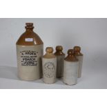 J.Clarke, Eastern Ipswich, three stoneware advertising bottles, centred with initials within a