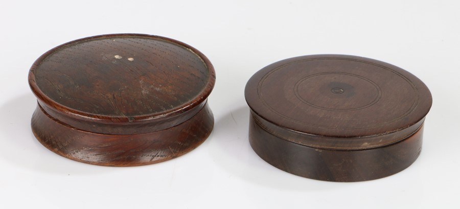 Two George III snuff boxes, a mahogany and an oak example, each of circular form (2)