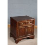 17th century style oak cupboard, the rectangular moulded top above a single long drawer with brass