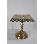 Victorian brass trivet stand, with square pierced platform and circular foot, with registration