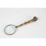 Late 19th Century brass magnifying glass with bull mastiff head finial, brass strapping to the