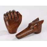 Two carved oak novelty walking stick handles, one in the form of a dogs head, the other in the