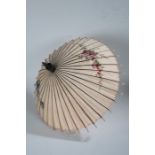 20th century eastern silk parasol, painted with roses and a building within a landscape setting,