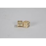 Two late 19th/ early 20th century ivory dice (2)