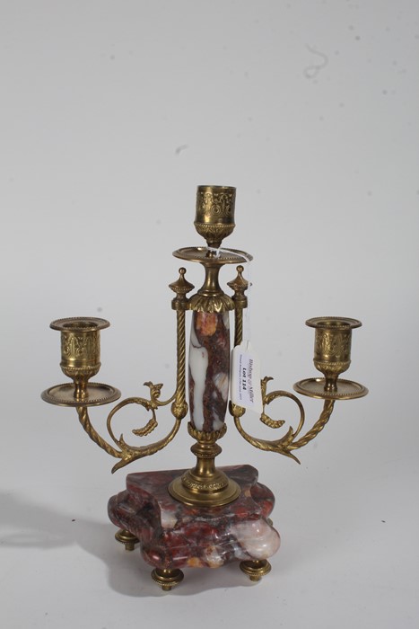 19th century marble and brass candelabra, having scrolling branches raised on a rouge marble