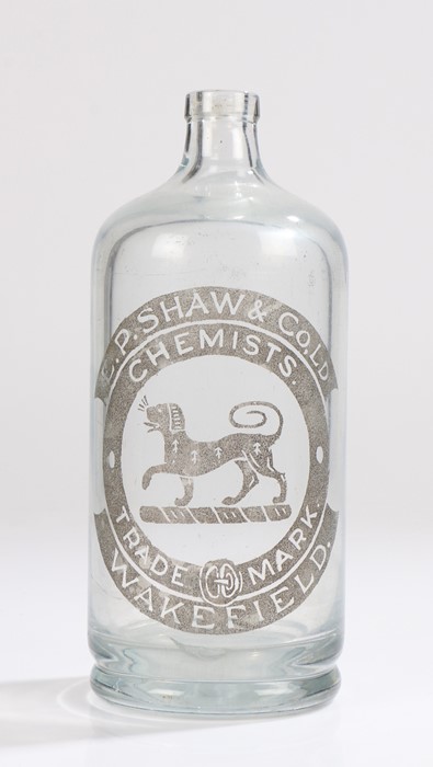 E.P Shaw & Co Ltd Chemists glass bottle, with a dog to the entre of the logo and text surround,