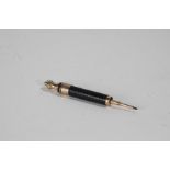 19th century yellow metal mounted telescopic propelling pencil, with black body, 11cm long when