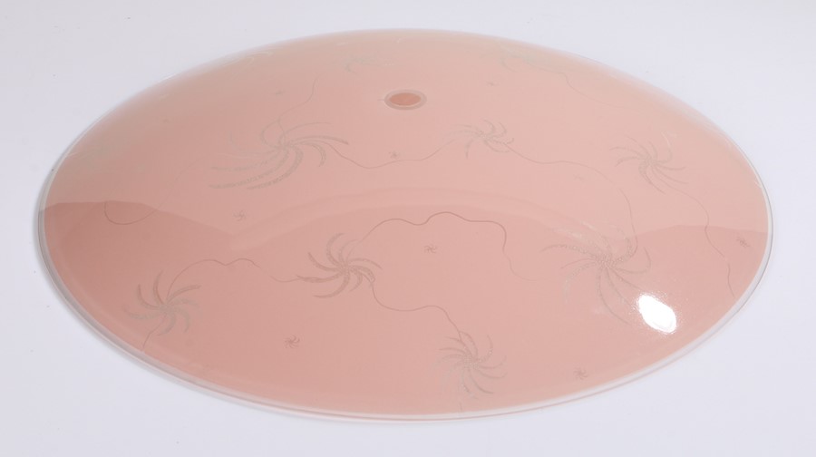 Art Deco style glass lamp shade, in pink decorated with swirls, 48cm diameter