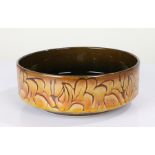 Poole pottery Aegean bowl, by Karen Ryall, with an outer band of floral design, brown glazed