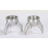 Pair of Art Deco style cast aluminium novelty egg cups, in the form of rocket fins, each 6cm high (