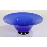 Venini, blue glass bowl with flared rim, black circular foot, signed to base, 26.5cm diameter