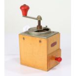 West German wooden coffee grinder, with red winding handle, stamped KYM to the front, also with a