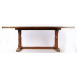 Derek "Lizardman" Slater oak refectory table, the rectangular adzed top above angular columns and