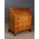 Art Deco walnut bureau, the drop front enclosing a pigeon hole interior and green baize writing