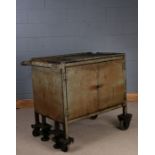 Industrial metal workshop portable cabinet, painted in green, having a pair of hinged doors