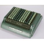 Sumlock adding machine, by Bell Punch Co. Ltd., with dust cover