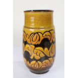 Poole pottery vase, with an abstract design in brown on a yellow ground, 23.5cm high
