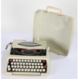 Smith-Corona De Luxe portable typewriter, housed in a plastic carrying case