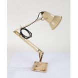 Angle Poise lamp, by Herbert Terry & Sons, raised on stepped square base