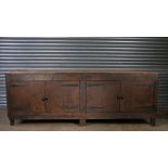 Large 20th Century cobblers work bench, the parquetry top above two pairs of hinged doors