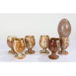 Set of six onyx cups, 9cm high, together with a marble egg (7)