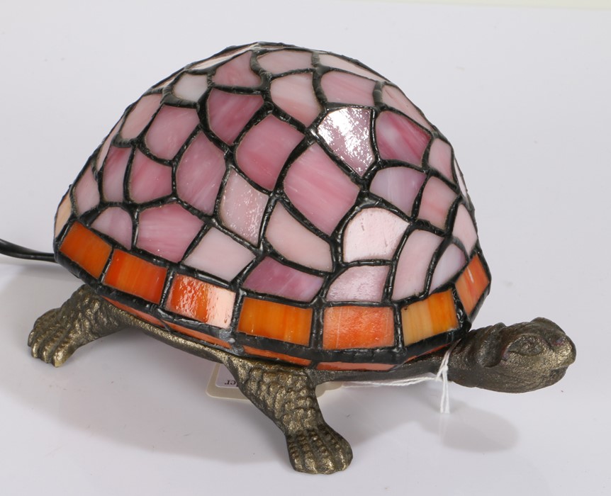 Tiffany style table lamp, in the form of a tortoise, with pink and orange shade, brass body, 20cm