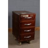 Set of portable bank drawers/till, fitted with four drawers and raised on four large wheels, 43cm