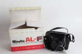 Minolta AL-F camera, with a Rokkor f/2.7 38mm lens, including a Helios flashgun, in original box