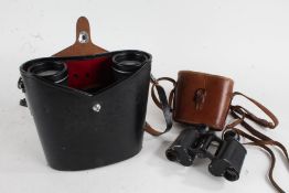 Pair of Asahi Pentax prism binoculars, 10x50 field 5.5, housed in a leather case, and a pair of