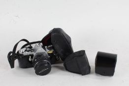 Pentax ME SLR camera, with an Asahi Pentax-M f/2 50mm lens, housed in a leather case, including an