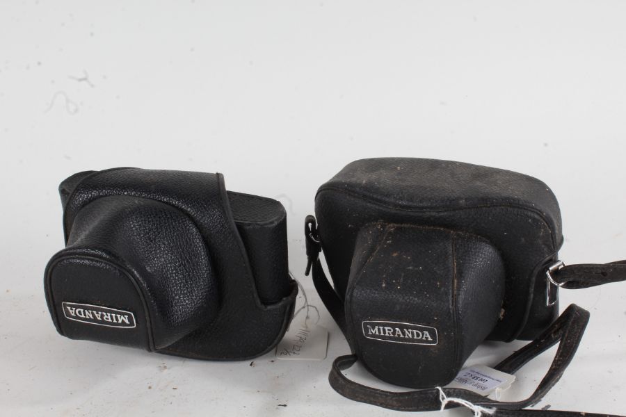Two Miranda EE-2 cameras, with a f/4 50mm and a f/1.8 50mm lens, both in leather cases (2)