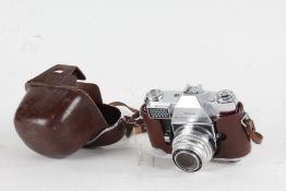 Kodak Retina Reflex III camera, with a Schneider-Kreuznach Curtagon f/2.8 35mm lens, in a leather