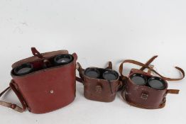 Three pars of binoculars, to include a Beck Hassel Jagdfalke 7x50, and two early 20th Century
