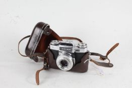 Zeiss Ikon Contaflex camera, with a Tessar f/2.8 50mm lens, housed in a brown case