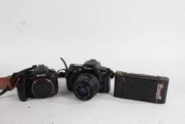 Kodak Brownie No. 2 Autographic folding camera, together with a Minolta Dynax 5xi camera, with a