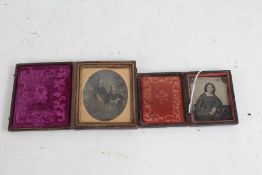 Two 19th Century ambrotypes, depicting two seated youthful ladies, with gilt brooch highlights,