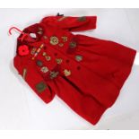 1940's child's coat with various insignia and badges sewn on, mainly reproduction, the coat was used