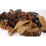 Mixed lot, shotgun cartridge belts, pistol holsters, leather equipment straps, winter hats,